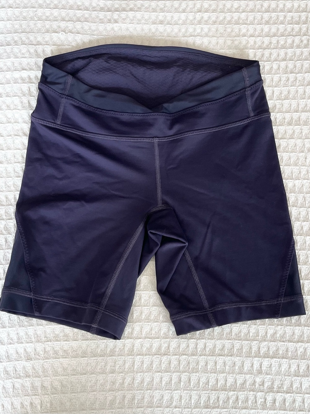 Lululemon dark purple 7” inseam bike
shorts size 4
